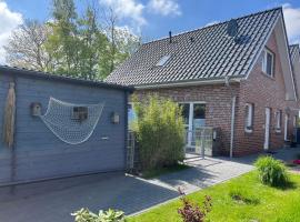 Haus Nordseeliebe mit Außensauna, Outdoor Dusche und Wallbox, hotel en Dornum