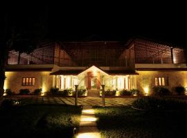 The Windchimes Retreat Coorg, familjehotell i Virajpet