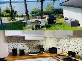 Nice Apartment with1 bedroom Separate living room with a sofa bed and a tiny kitchen a bathroom located in Nordstrand near by the Sea for 3 guests with a garden and grill 5 extra guests with extra cost in the cabin with sea view just outside the apartment