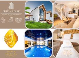 Olivina Park Spa - domki z dostępem do krytego basenu, saun, wyżywienia i atrakcji dla dzieci, παραθεριστική κατοικία σε Niechorze