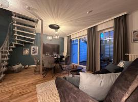 Luxx Downtown - Design-Apartment zentral im Ort, rumah liburan di Bad Zwischenahn