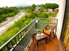 Aachman River and Valley View Resort Dharamshala - A riverside resort with balcony view