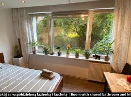 Room with shared bathroom and kitchen