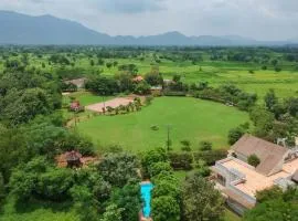 Nivaant Farms & Cottages - Nestled in lush greenery, offering a Swimming pool, Orchard, Jacuzzi & A spacious lawn with gazebo