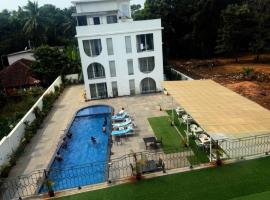 Goa Courtyard by the porto Arpora, hotel en Baga