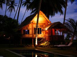 Bon Ton Antique Wooden Villas, hotel di Pantai Cenang