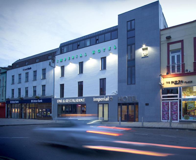 a building on a street with a street at Imperial Hotel Galway in Galway