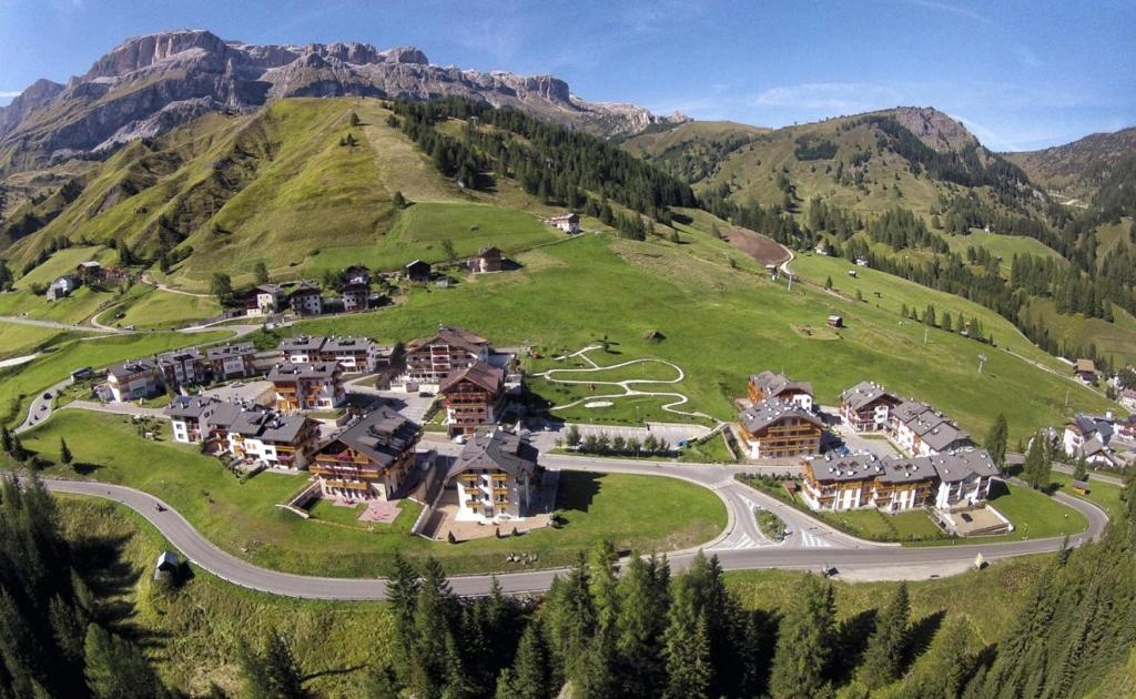 an aerial view of a house on a mountain at Appartamenti Home Service in Arabba