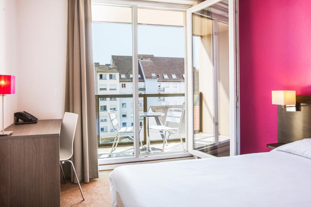 Vuode tai vuoteita majoituspaikassa Aparthotel Adagio Access Strasbourg Petite France