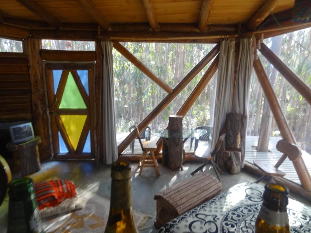 a view of the inside of a cabin with a window at Cabanas Curi-Huapi in Isla Negra