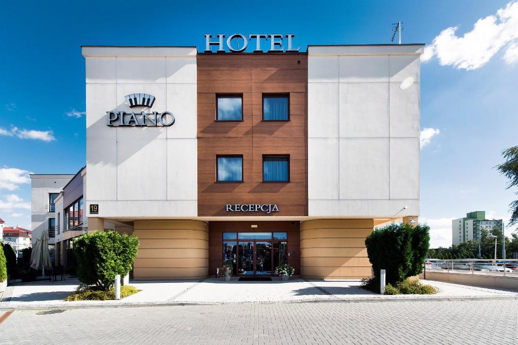 a hotel with a sign on the front of it at Hotel Piano in Lublin