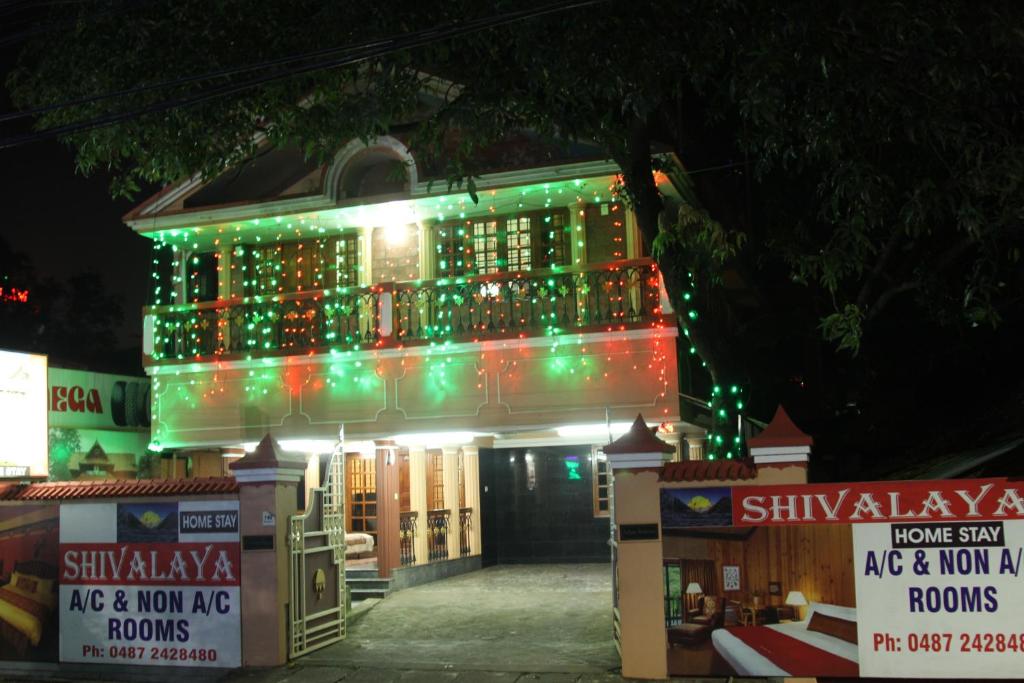 a lit up building with christmas lights on it at ShivalayaHomestay in Trichūr