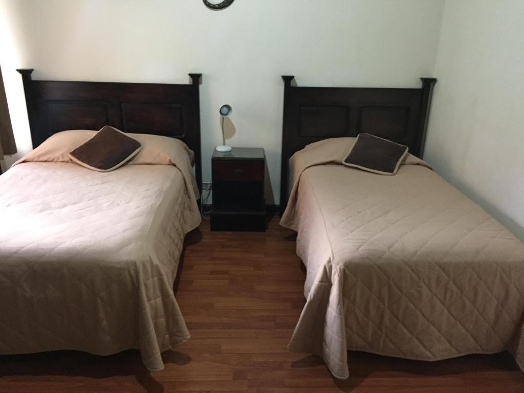 A bed or beds in a room at Comfort Hostel