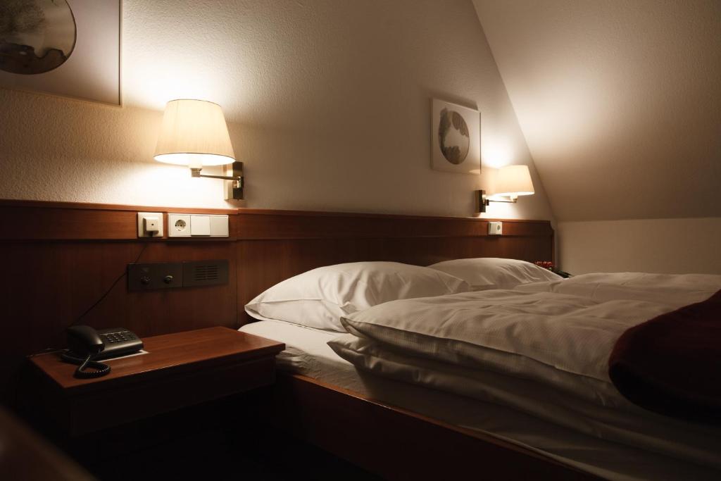 Tempat tidur dalam kamar di Hotel Zeller Zehnt