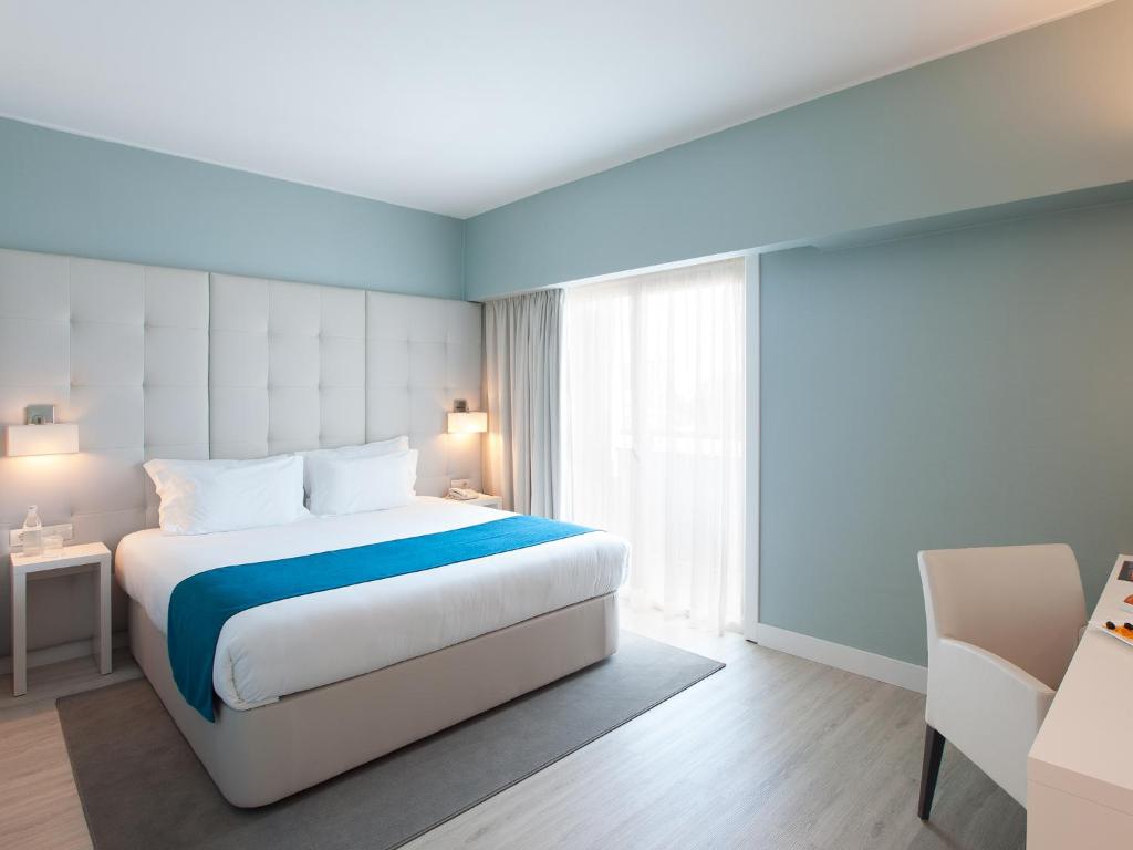 Ліжко або ліжка в номері Lutecia Smart Design Hotel