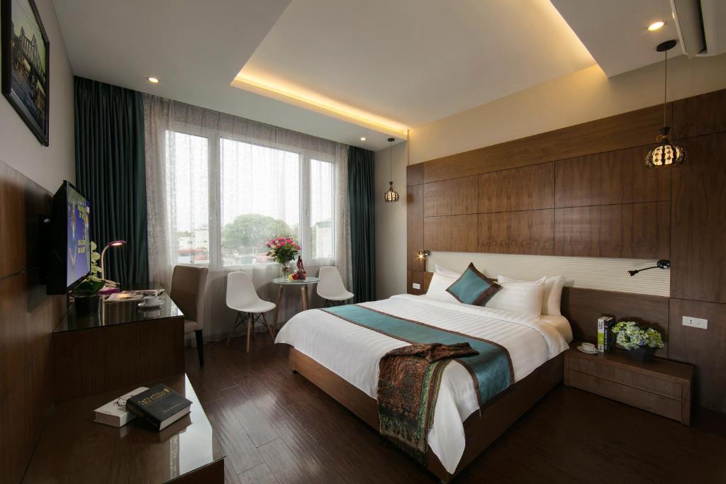 Krevet ili kreveti u jedinici u okviru objekta Bonne Nuit Hotel & Spa Hanoi