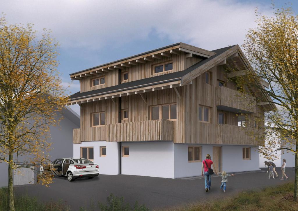 a rendering of a house with a wooden roof at Apartment Kristall in Finkenberg