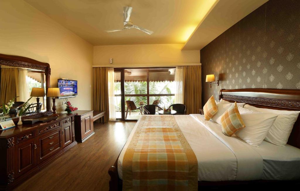 Uma cama ou camas num quarto em Uday Samudra Leisure Beach Hotel & Spa