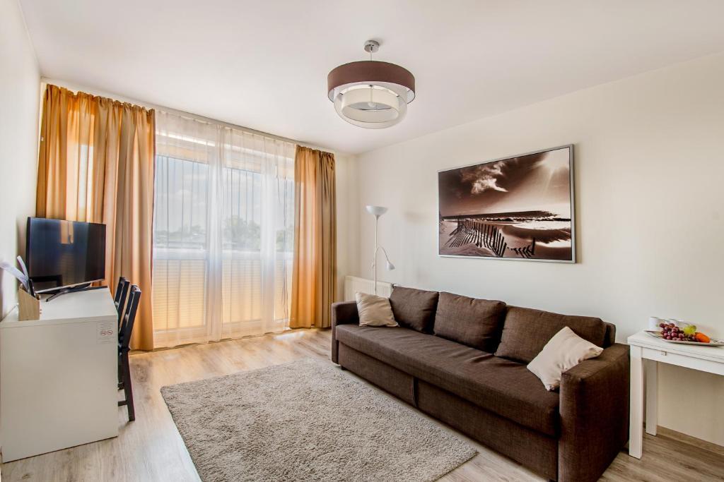 TV i/ili multimedijalni sistem u objektu Apartament Poniatowskiego - Komfortowe Noclegi