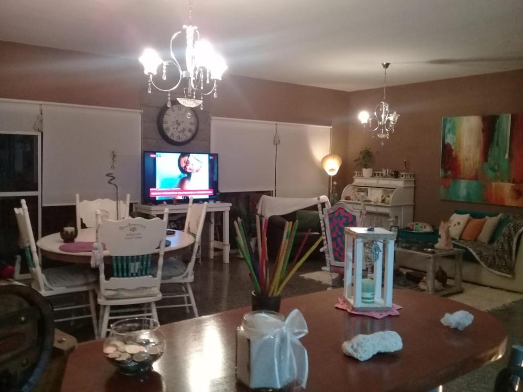 a living room with a table and a tv at Mi Lugar en el Mundo in Buenos Aires