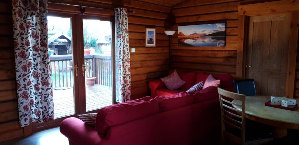 Prostor za sedenje u objektu Glenmhor Log Cabin