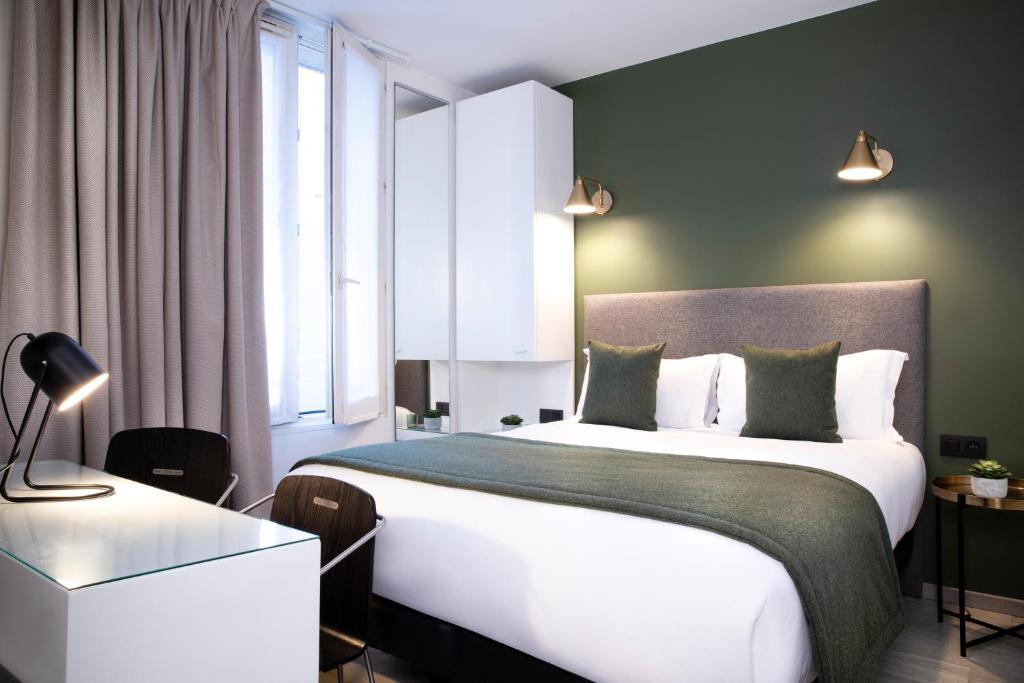 Hotel Brady - Gare de l'Est में एक कमरे में एक या कई बेड