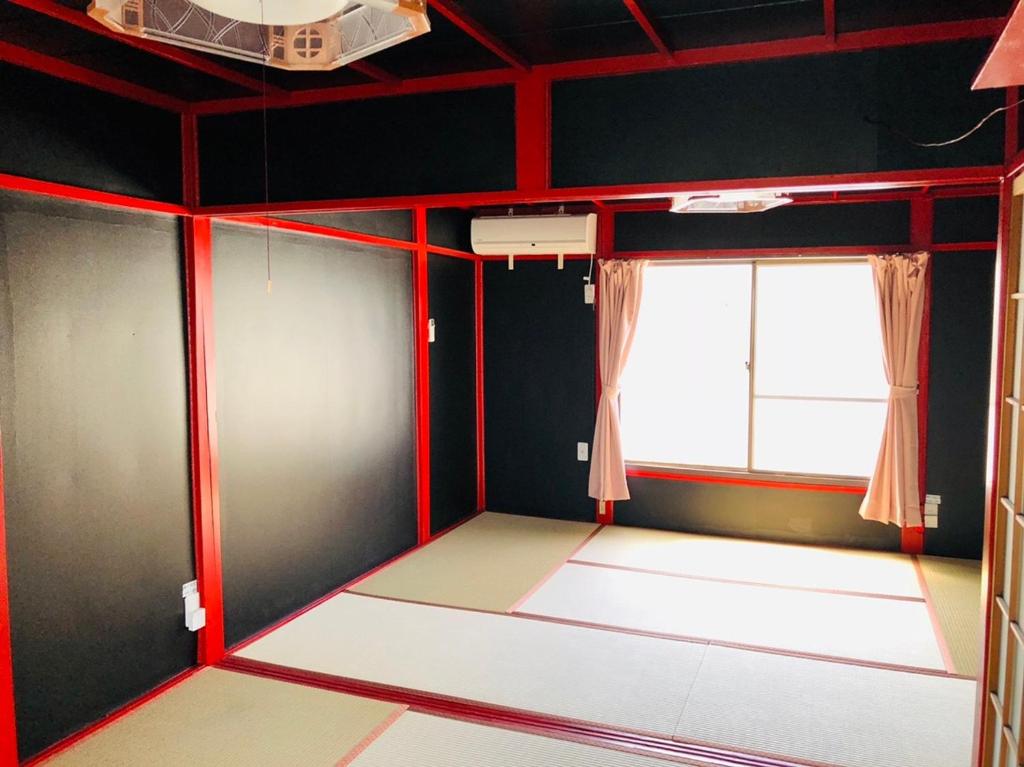 Yokohama Sakae-chou Ninja House #JA1 tesisinde bir odada yatak veya yataklar