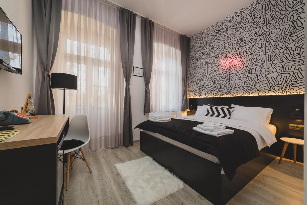 Gulta vai gultas numurā naktsmītnē Hotel Marienplatz Podgorica