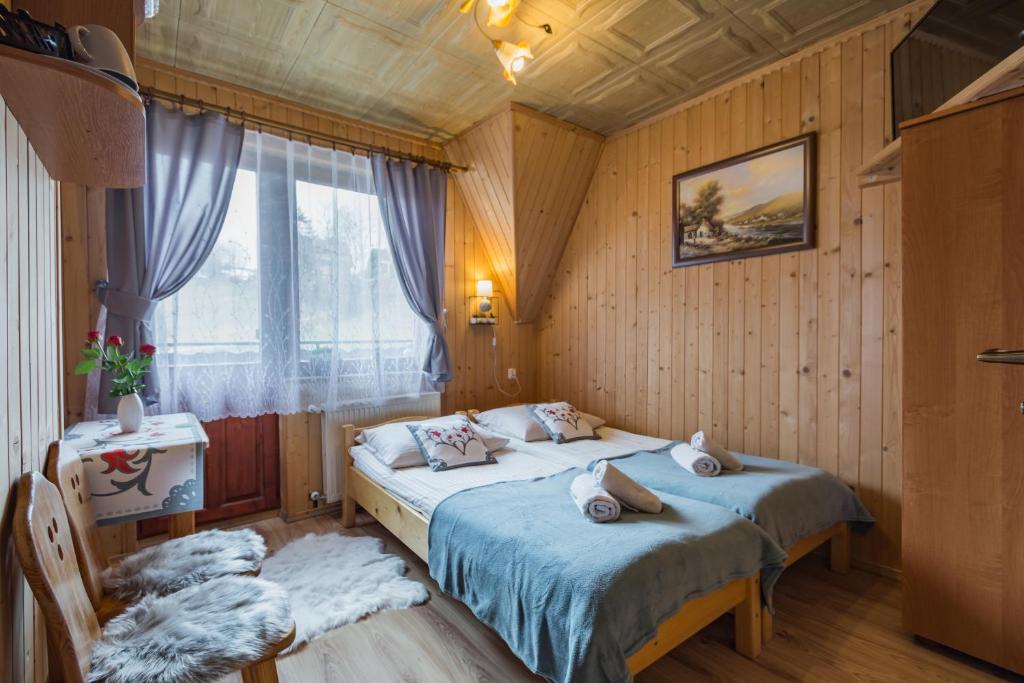 A bed or beds in a room at Agrotatry U Stachy