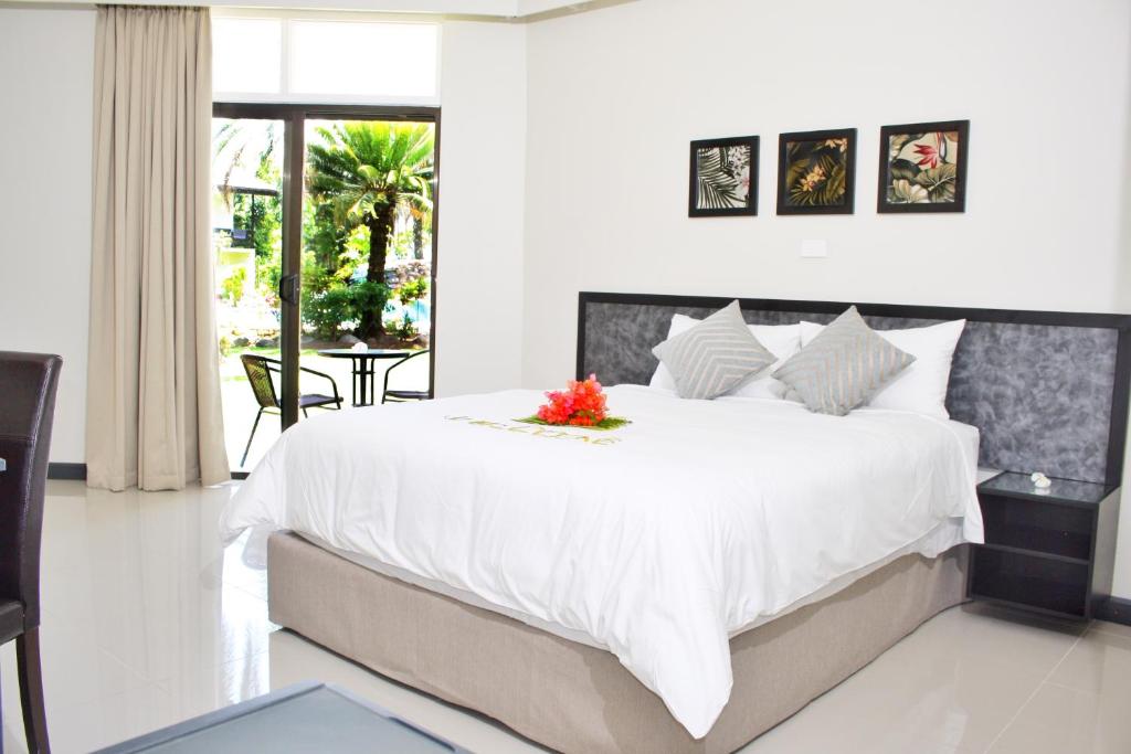 Cama ou camas em um quarto em Hotel Oasis