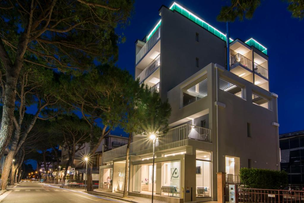 a building with lights on the side of a street at Almalux Jesolo Wellness & Spa 3 stelle superior in Lido di Jesolo