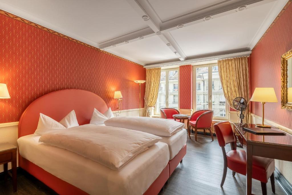 En eller flere senger på et rom på Boutique Hotel Belle Epoque