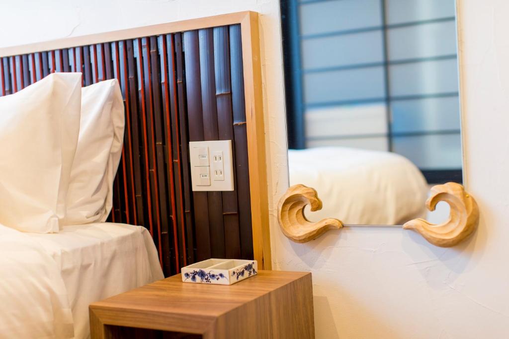 Tempat tidur dalam kamar di Wanosato Kyoto Musee