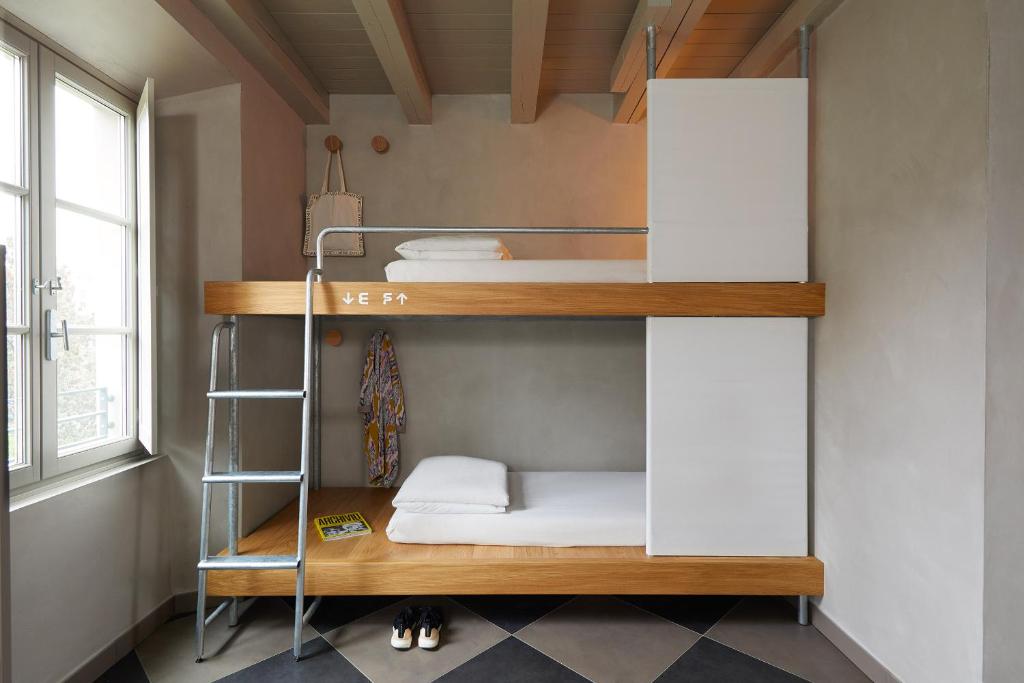 Una cama o camas en una habitación de Combo Milano