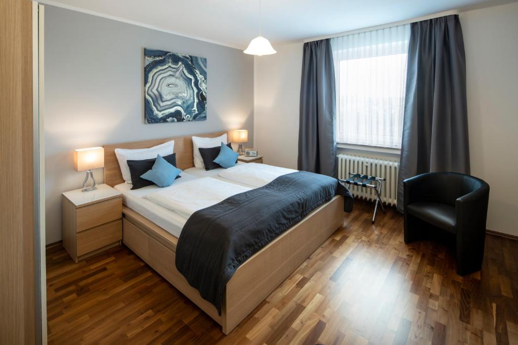 Кровать или кровати в номере Hotel Birkenstern