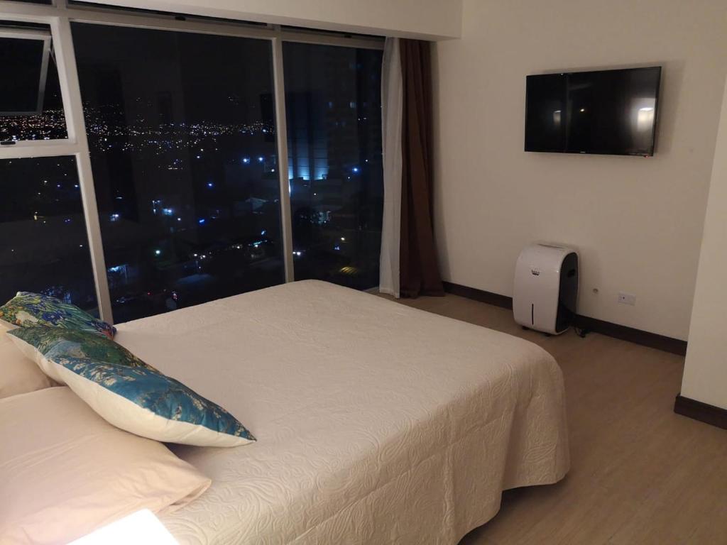 Cama ou camas em um quarto em El mejor apartamento en excelente ubicación.