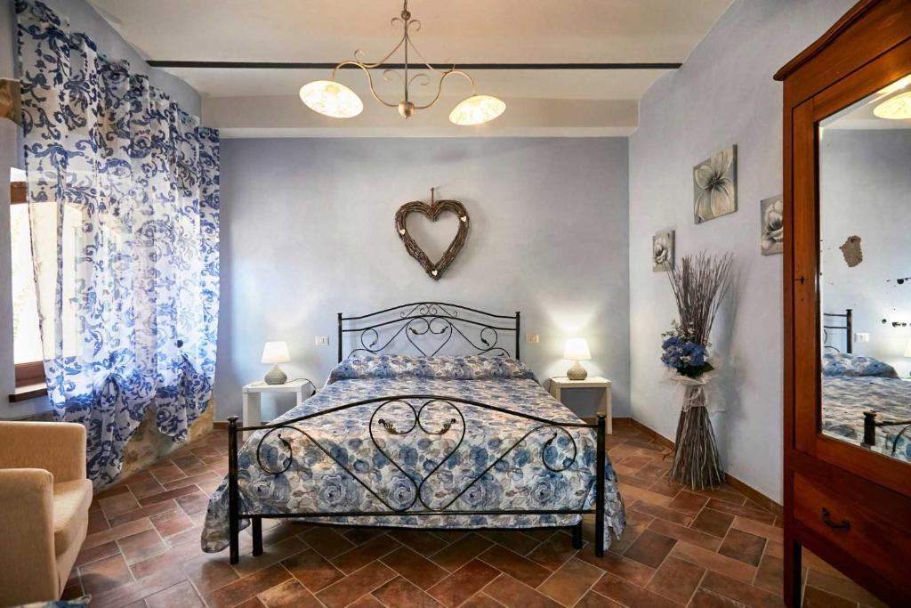 Cama ou camas em um quarto em Agriturismo MonteCrespini