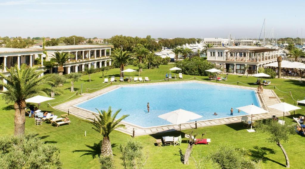 an overhead view of a swimming pool in a resort at Porto Romano - The Marina Resort in Fiumicino