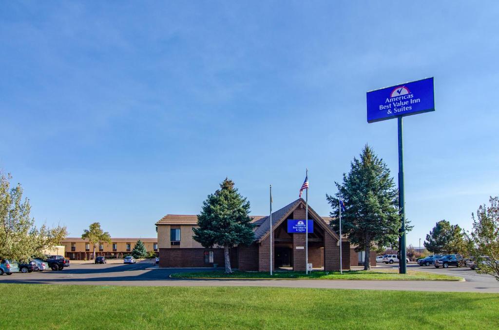 a building with a sign in front of it at Americas Best Value Inn & Suites Ft Collins E at I-25 in Fort Collins