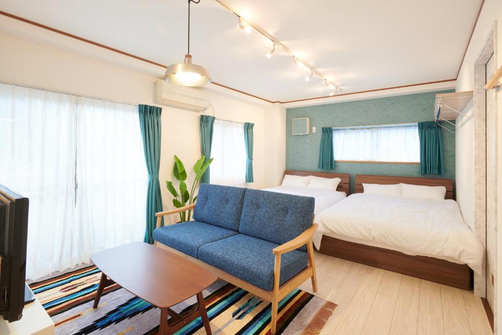 Кровать или кровати в номере Awaji Portside Holiday Home CHOUTA - Self Check-In Only