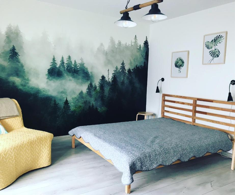 Una cama o camas en una habitación de Bielski Zakątek bezobsługowy