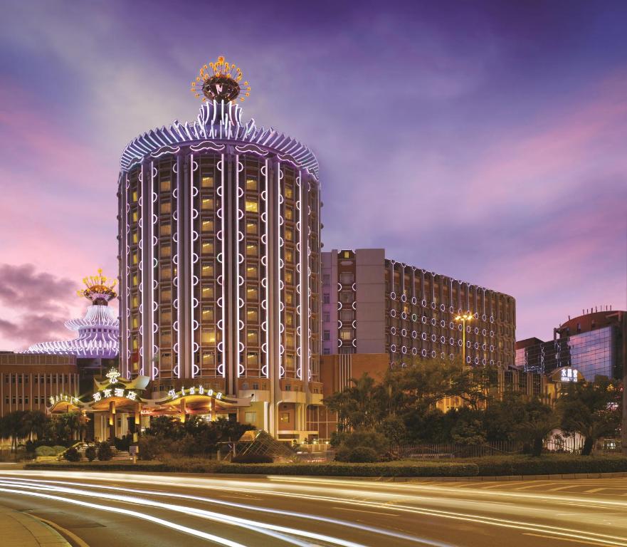 a large building with a flower on the top of it at Hotel Lisboa in Macau