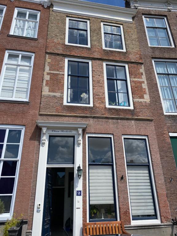 a red brick building with white windows at Cleen Rochelle in Middelburg