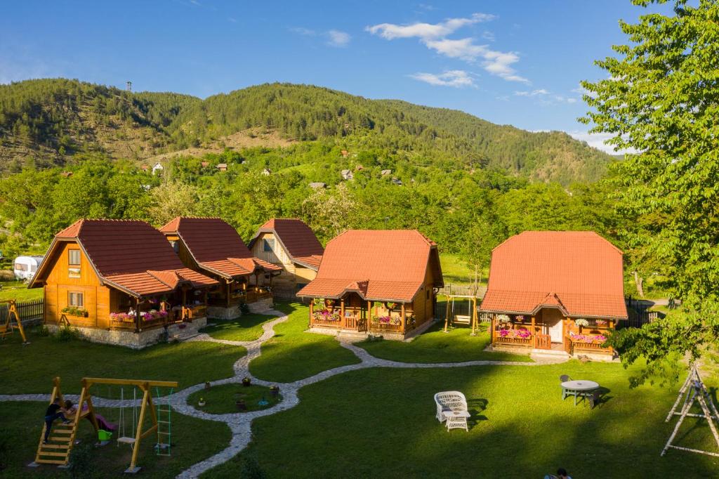 an aerial view of a house with a playground at Apartments Milev in Mokra Gora