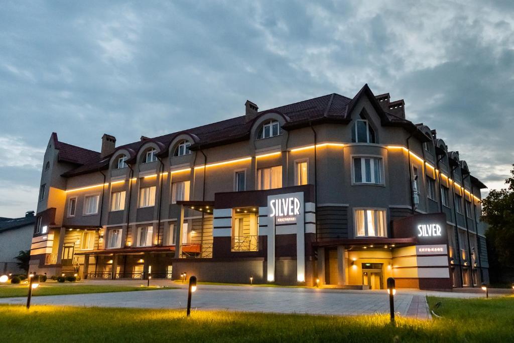 a large building with lights in front of it at Готельно-рестораний комплекс Silver in Ivano-Frankivsʼk