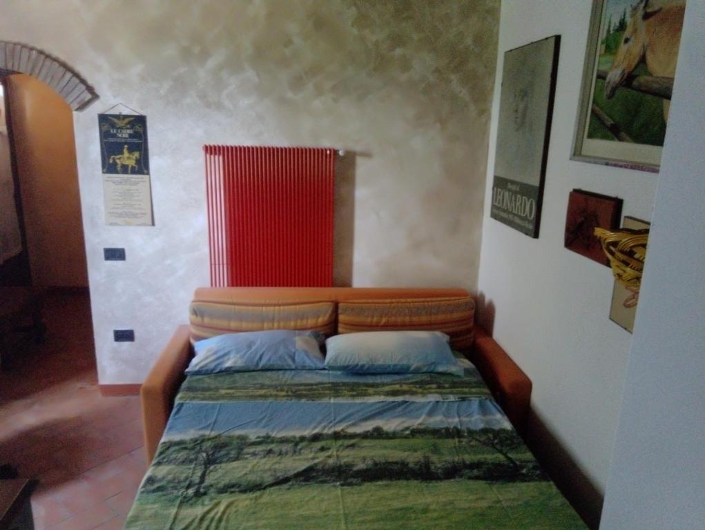 A bed or beds in a room at Poggio delle Capre