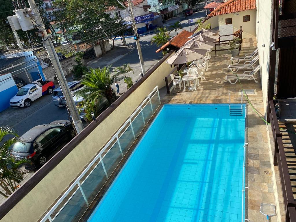 A piscina localizada em Casa temporada Cabo Frio ou nos arredores