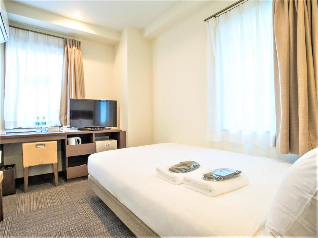 SHIN YOKOHAMA SK HOTEL - Smoking - Vacation STAY 86108 tesisinde bir televizyon ve/veya eğlence merkezi