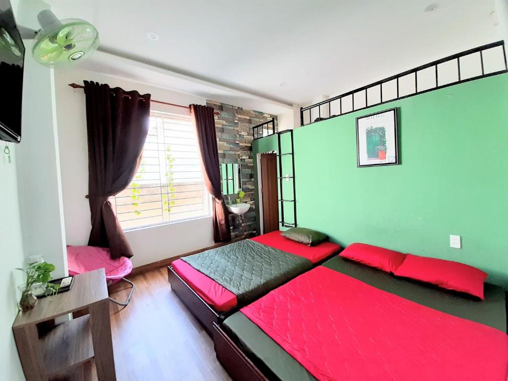 A bed or beds in a room at Homestay Xì Trum