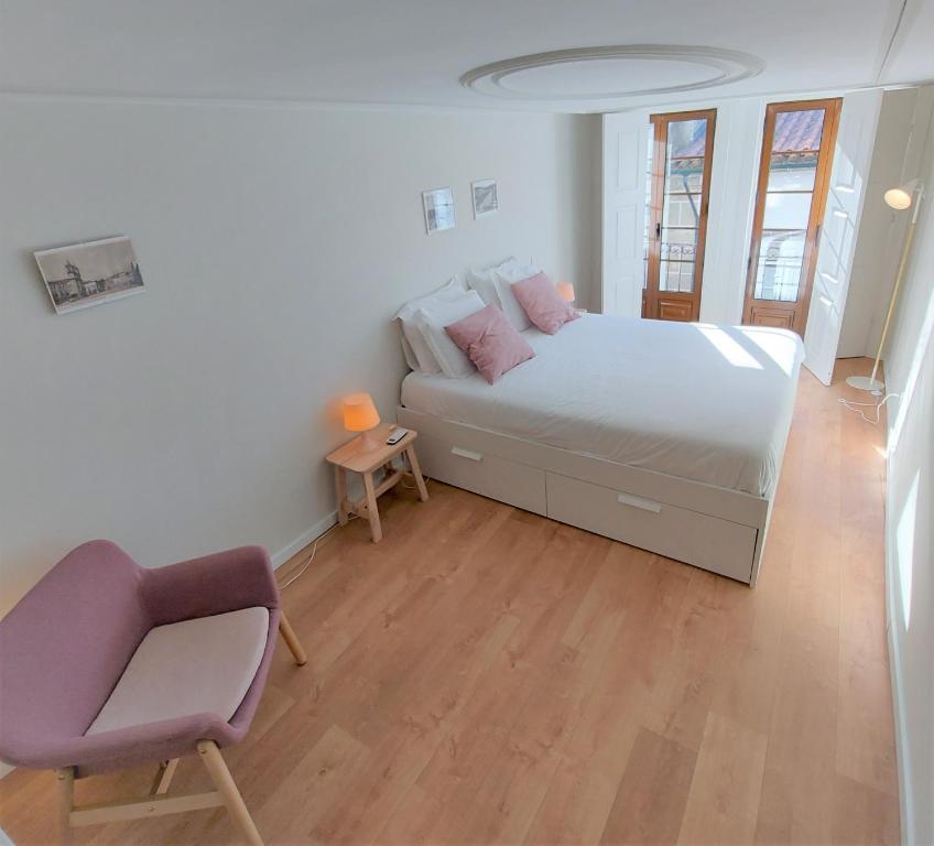 A bed or beds in a room at Anjo33 Flats